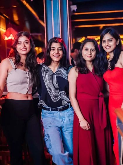 A group of friends dressed in their weekend best, ready to enjoy the party. The crowd at my events always brings their best energy.