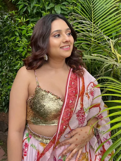 The soft, glowing makeup looks beautiful in the natural outdoor light, creating a truly enchanted feel.