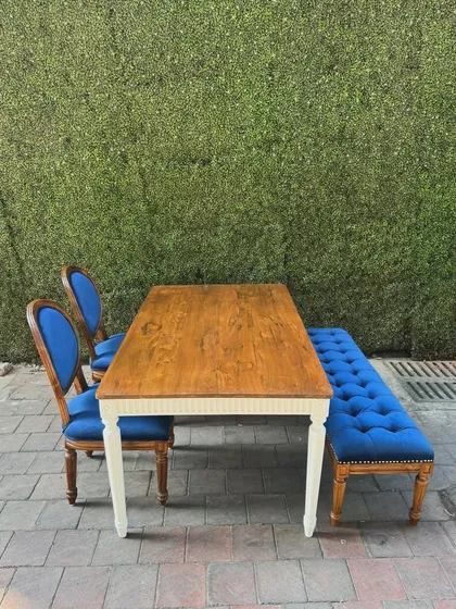 A different angle of the dining set against a green wall.