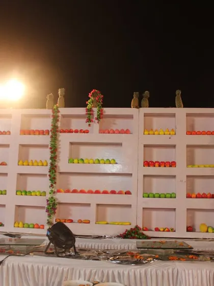 Another view of our extensive fruit wall display. The fruits are arranged neatly by color and type, creating an impressive and appetizing feature for any event.