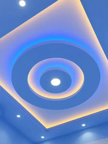 A striking circular design that adds a focal point to any room. This ceiling features multiple concentric circles with alternating warm and cool LED lighting, creating a captivating visual effect.