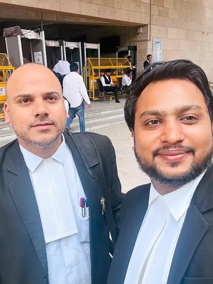 With a colleague at the Rohini Court. Collaboration with other legal professionals is an important part of building a strong case strategy.
