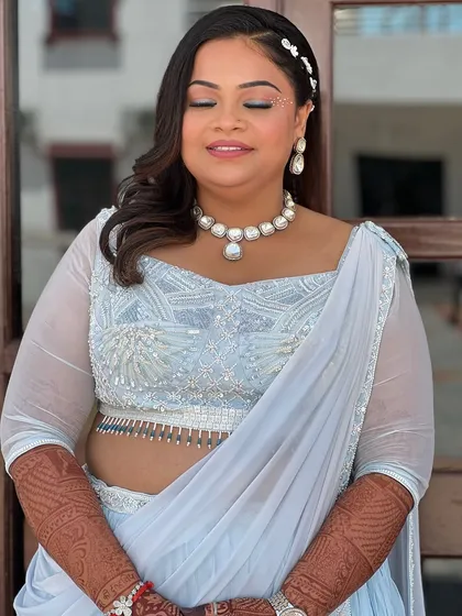 A close-up of the makeup, with her eyes closed to show the subtle shimmer and winged liner.