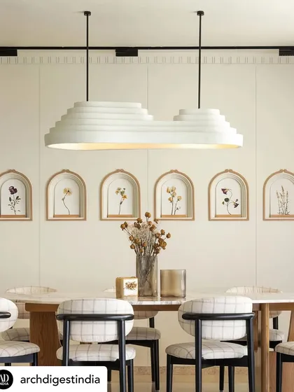 The dining area of KAIA, with its custom light fixture and wall art, was another beautiful shot from our feature in Architectural Digest. It highlights our commitment to bespoke details that tell a story.