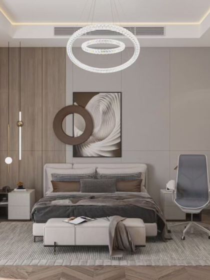A sophisticated bedroom design that includes a dedicated workspace. The room features a neutral color palette, a modern circular chandelier, and a mix of wood and grey tones for a calm and productive atmosphere.