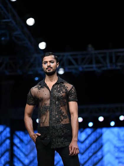 A portrait from the runway, capturing the mood of the collection with a focused and intense gaze.