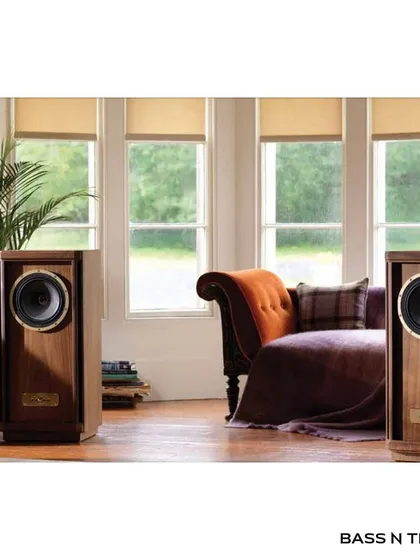 The Tannoy Stirling Gold Reference loudspeaker in a classic living room. Handcrafted in Scotland, it's a masterpiece of British audio heritage designed for medium to large rooms.
