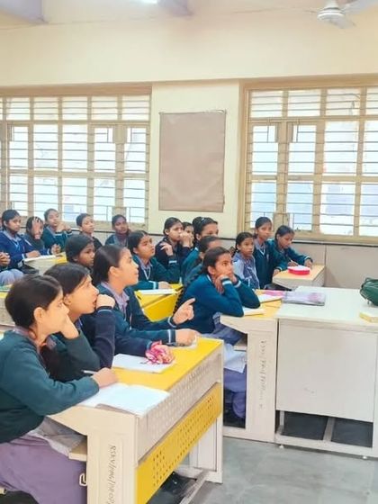 Explaining a concept to students. I use simple language and relatable examples to ensure the information is easy to digest and apply in their daily lives.