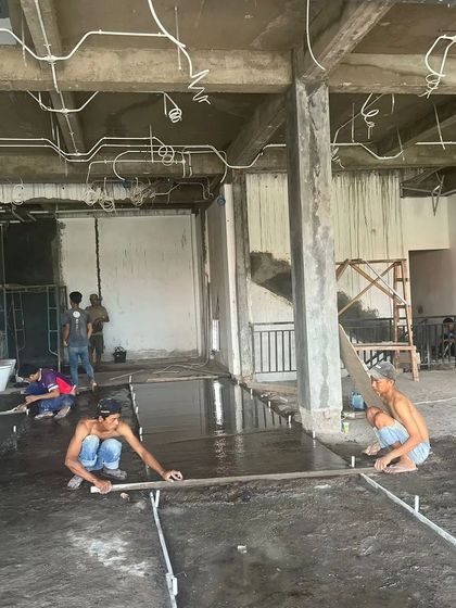 Workers laying the flooring at our project site in Bali. As the project manager, I oversee all on-site activities, ensuring that every task, from structural work to finishing touches, is completed to a high standard.