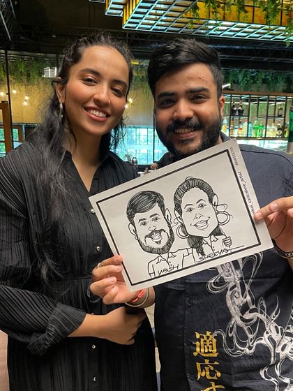 Drawing a happy couple at the Glocal restaurant in Mumbai. Live caricatures are a great icebreaker and a fun activity for guests at any party or get-together.