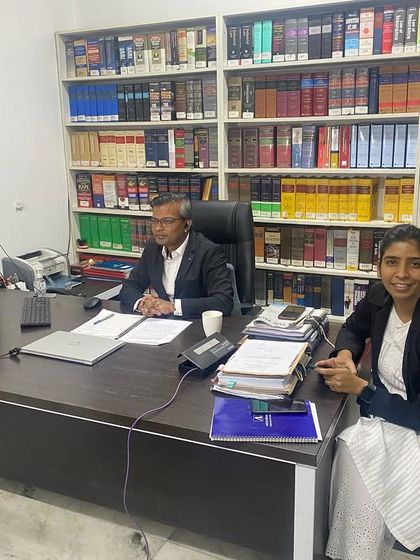 With my colleague in the office, set up for a virtual conference or media interview. Modern legal practice requires adapting to new communication technologies.