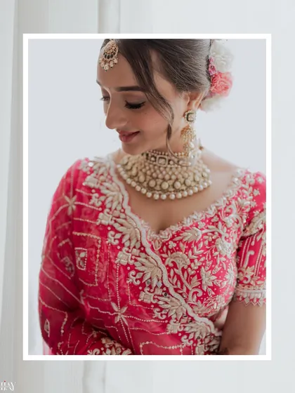 A soft and delicate portrait of the bride, focusing on her serene expression and beautiful wedding jewelry.