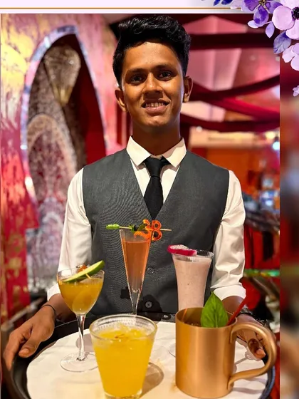 A tray of assorted mocktails being served at a grand wedding at Leela Delhi, showcasing our excellent service.