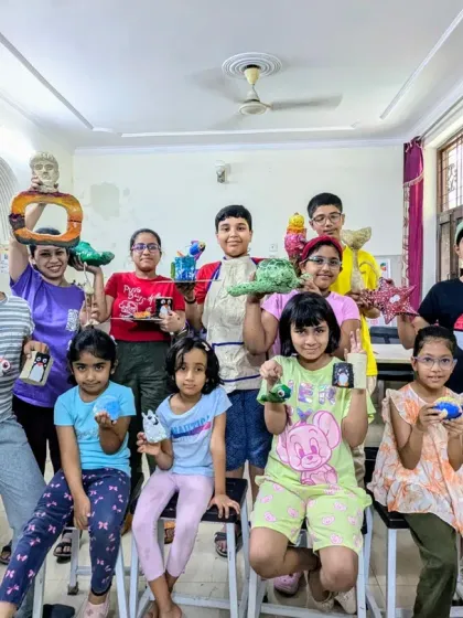 Another happy group with their finished papermache projects. It's wonderful to see the pride on their faces as they show off their unique 3D creations.