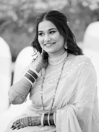 A classic black and white portrait of the reception bride, highlighting her features and the timeless elegance of the look.