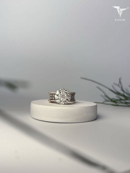 This floral-inspired ring captures the essence of wild blossoms, crafted in gold and crowned with radiant diamonds that speak of elegance and eternity.