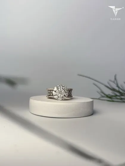 This floral-inspired ring captures the essence of wild blossoms, crafted in gold and crowned with radiant diamonds that speak of elegance and eternity.