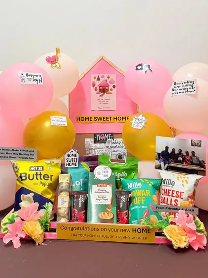 A new home deserves a warm welcome. This housewarming hamper is filled with snacks, treats, and personalized notes on balloons, all centered around a 'Home Sweet Home' theme to help them celebrate their new beginning.