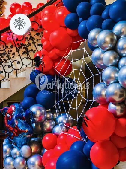 Your friendly neighborhood Spider-Man! For this superhero party, we created a dramatic balloon arch in classic red, blue, and silver, complete with spiderweb details and a Spider-Man foil balloon.