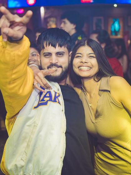 Capturing the fun and friendly vibe of the night. People are here to relax and have a good time.