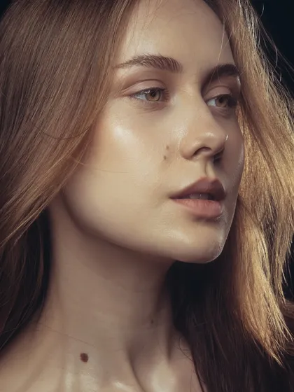 Here, the focus is on the flawless skin texture and subtle contouring. This kind of clean beauty work is essential for campaigns where the skin itself is the main subject.