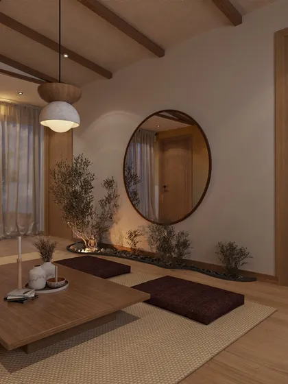 For a client in Pune, I designed this Zen room as a dedicated space for meditation and peace. Low seating, natural wood beams, and an indoor plant bed create a grounding atmosphere. The large circular mirror reflects the soft light, enhancing the room's tranquil, balanced energy.