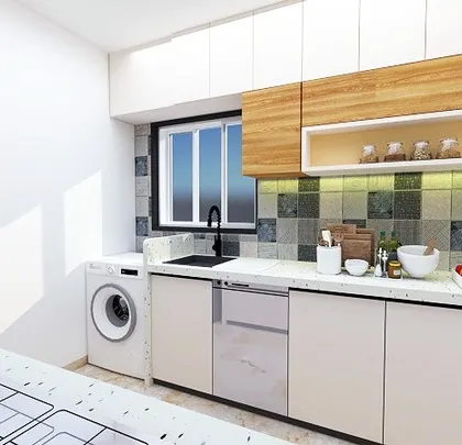 Another view of the proposed kitchen, showing the placement for a washing machine and dishwasher. We plan for all your appliance needs right from the design stage.