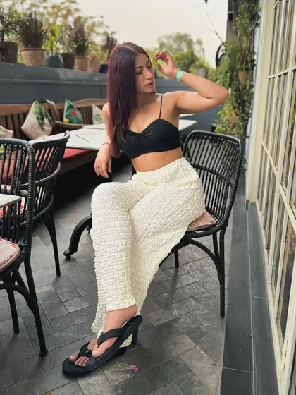 Posing in the chic and comfy black and white outfit.