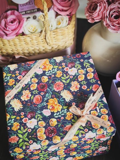 The elegant floral wrapping of our "Good Vibes, Good Life" Mother's Day hamper, tied with a custom ribbon.