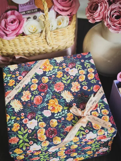 The elegant floral wrapping of our "Good Vibes, Good Life" Mother's Day hamper, tied with a custom ribbon.