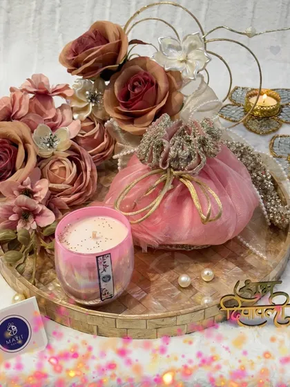 Another one of my signature Diwali hampers. This one features a pink 'potli', a scented candle, and beautiful 't-light' holders, all arranged on a lovely tray.