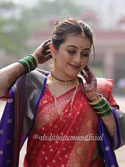 Bride Divya looking beautiful and serene. Her makeup is natural and understated, letting her inner beauty shine through.