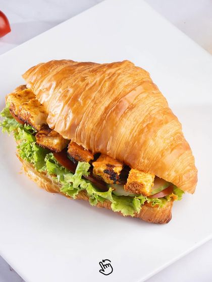 We've turned the classic croissant into a satisfying meal. This one is filled with flavorful paneer tikka and fresh greens.