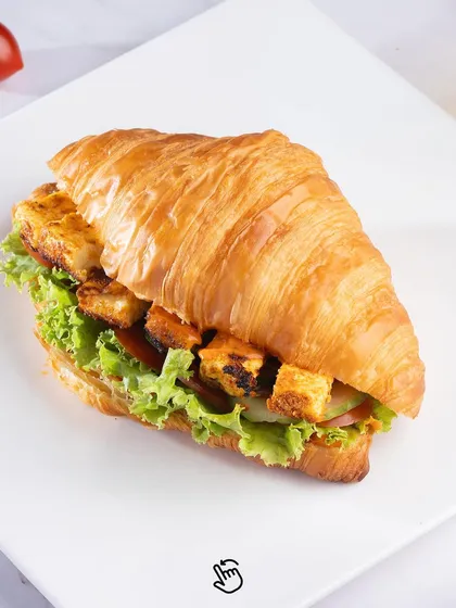Our Paneer Tikka Croissant Sandwich. A delicious fusion of flavours with spiced paneer tikka, crisp lettuce, and veggies packed into a freshly baked croissant.
