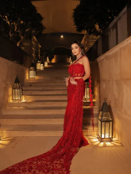 For the glamorous reception or cocktail night, a bold red gown makes an unforgettable statement. I work with you to select dramatic, high-fashion pieces that showcase your personality, ensuring you shine at every single wedding event. This is pure modern elegance. 🍒