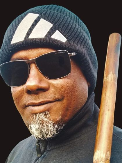 A portrait with a Bo Staff. This simple wooden staff is a versatile and effective weapon, and one of the first we introduce in our weapons program.