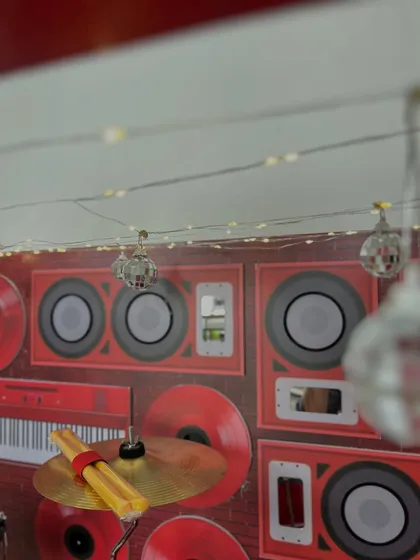 It's all in the details! Tiny disco balls hang from the top, reflecting light and adding to the rockstar vibe of this fun-filled birthday hamper.