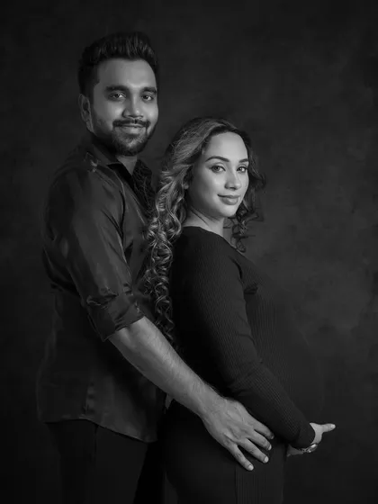 A classic and confident couple's portrait in black and white.