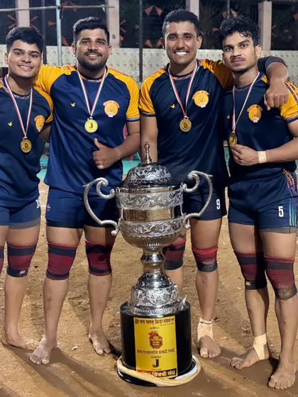 Our players proudly posing with their medals and the championship trophy. For us, senior players are more than coaches, they are big brothers.
