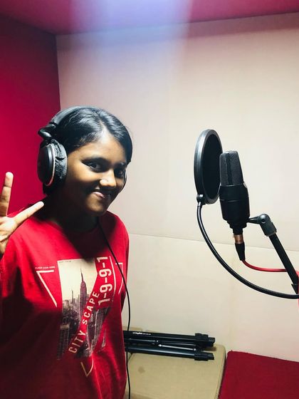 Another happy student in the studio. We ensure the recording environment is encouraging and positive, allowing students to give their best performance.