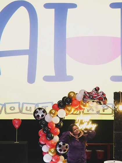 The theatre setup with our logo on screen, a testament to our growth and the love from our clients.