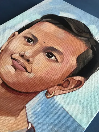A close-up detail of Mihika's portrait. I enjoy working with acrylics for their ability to create rich, opaque colors that make the final artwork so vibrant.