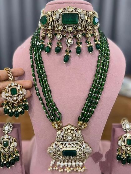 A layered emerald bead necklace set with a matching choker, inspired by designer bridal collections.