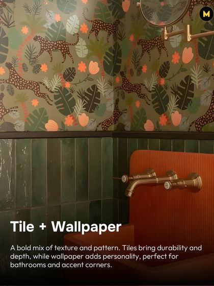 Don't be afraid to mix tile and wallpaper. This bathroom uses a bold mix of texture and pattern, with green tiles for durability and a vibrant jungle-themed wallpaper for personality.