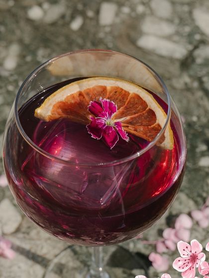 A close-up of our beautiful Purple Fuji cocktail, a refreshing and elegant drink.