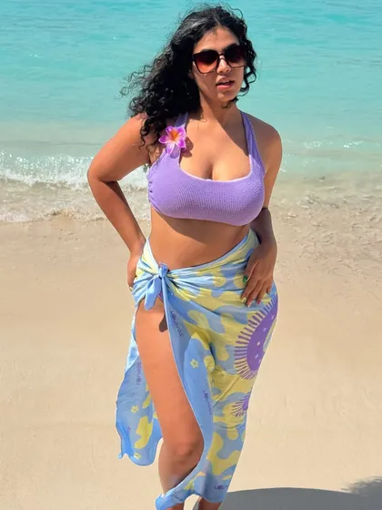 Summer in Bali. This lilac bikini paired with a colorful sarong is a fun and vibrant beach look. I love playing with color, even with my swimwear.