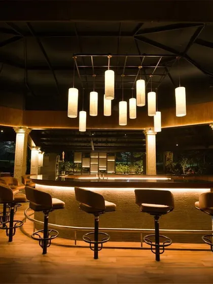 This is the 360-degree bar at the Bangalore Golf Club, a project with deep personal meaning for me. My design uses layered, low-level illumination and a dramatic central pendant cluster to foster a relaxed, glare-free ambiance where pools of light and shadow define the space.