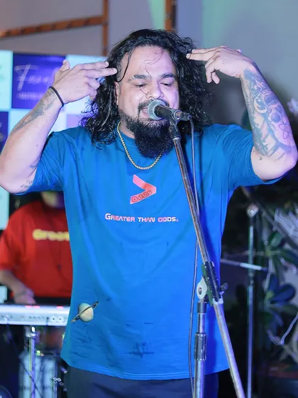 Another shot of our vocalist, fully immersed in the performance. His stage presence is a huge part of the MH43India experience.