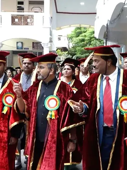 In discussion with the faculty during the academic procession.