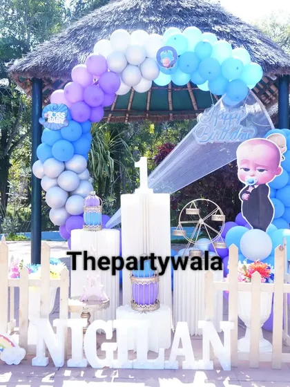 Another view of the outdoor Boss Baby setup. The picket fence and light-up name sign create a beautiful and defined party space.